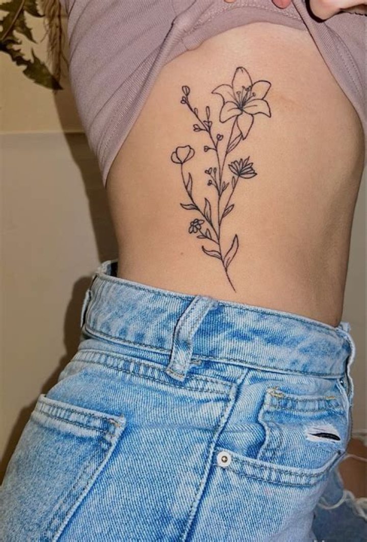 Alluring Flower Rib Tattoos: Delicate Designs That Bloom On Your Body